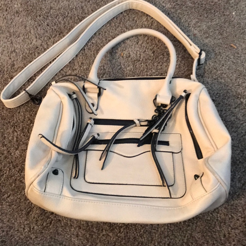Used apt 9 cream and black purse